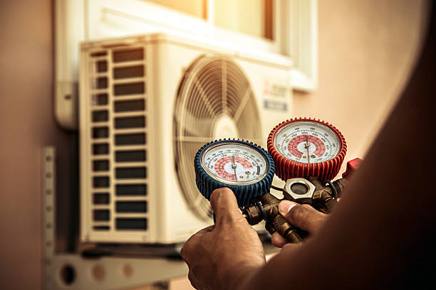 Professional Heat Pump Repair technician working in Boston, NY